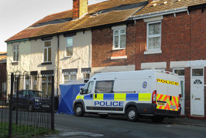 A police van and cordon outside the home of Mary Page in Bilston