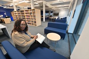 Teaching Assistant Angela Foster works inside the Learning Resource Centre