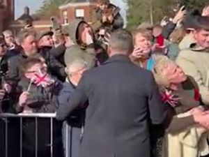 Supporting image for story: Charles asked ‘How long have you known about Andrew and Epstein?’ by protester