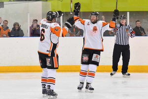 Rick Plant and Scott McKenzie celebrate after the former's goal made it 3-0 to Telford Tigers.