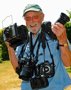 Graham Gough with his collection of cameras 