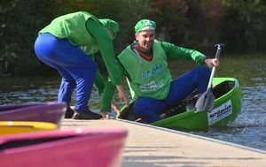 Here comes the green machine: A team makes a swift changeover in the Coracle World Championships