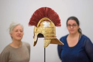 Two conservators inspect a reconstruction of a Helmet found in the Staffordshire Hoard at the Birmingham Museum and Art Gallery, Birmingham.