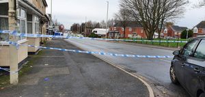 A police cordon was in place at Queens Cross in Dudley after the shooting.