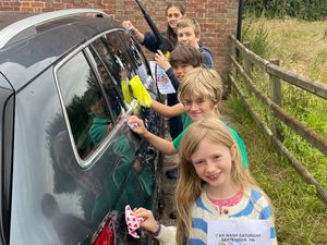 Supporting image for story: Revving up the suds! Community Car Wash Extravaganza