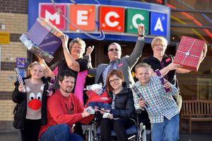 Matthew and Amy with baby Toby, Connor, Alisha and Mecca Bingo staff at the presentation event on Christmas Eve