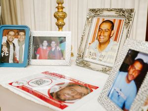 The entrance was decorated with photos of the happy young man. 