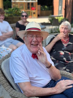 Resident Wearing a BIG SMILE along with his Dickie Bow & Hat ! 