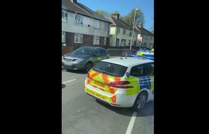 Police parked up near to Lloyd Street. Photo: James Davz 