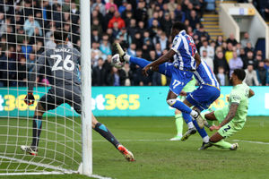 Di'Shon Bernard of Sheffield Wednesday clears the dangerous ball in the box from Darnell Furlong (Photo by Adam Fradgley/West Bromwich Albion FC via Getty Images).