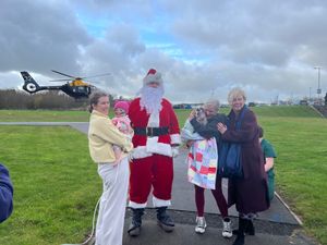 Santa was welcomed to the hospital by two youngsters currently receiving treatment.