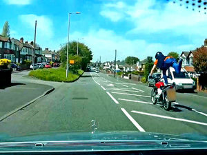 Supporting image for story: Watch: Daredevil biker's stupid stunt shocks driver