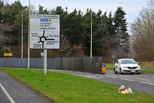 Floral tributes along the B5072, by Old Park Roundabout in Telford, where a pupil died after being hit by a car