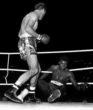 The then Cassius Clay being knocked down by Henry Cooper