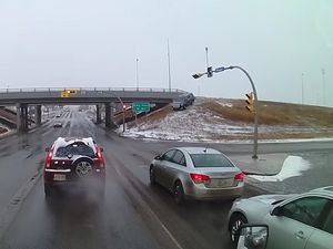 Supporting image for story: Cadillac driver narrowly misses stopped cars after careering down embankment