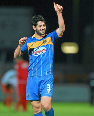 A thumbs up from goalscorer Joe Jacobson of Shrewsbury Town at the end of the match .