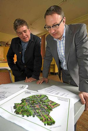 Andrew Marsden and Andrew Sheldon look at the plans