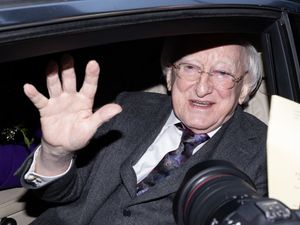 Supporting image for story: Michael D Higgins and Sabina given roses and cheered as term ends