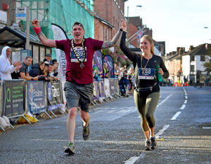 Oswestry Mayor Jay Moore and Mayoress Poppy King ran in their ceremonial chains