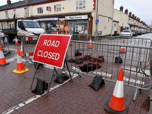Supporting image for story: 'I reported it yesterday - it could easily have hurt someone' - Wolverhampton residents react to appearance of 'three-foot' sinkhole near city centre