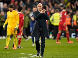 Arne Slot applauds the Liverpool fans after defeat to Paris St Germain