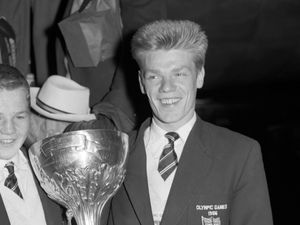 Flyweight Terry Spinks, left, and lightweight Dick McTaggart hold the Val Barker Cup between them