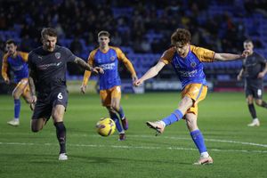 Tommy McDermott of Shrewsbury Town has a shot fish wide