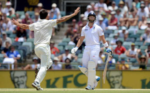 England's Matt Prior (centre) reacts after being caught behind by Australia's Brad Haddin (not pictured) off the bowling of Mitchell Johnson (left)