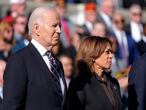 Joe Biden and Kamala Harris look on during a wreath-laying ceremony at the Tomb of the Unknown Soldier at Arlington National Cemetery
