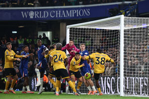 Jackson Tchatchoua clears off the line (Photo by HENRY NICHOLLS/AFP via Getty Images) 