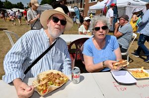 Geoffrey and Linda Evans tuck in at the Wrekin Eatin' festival.