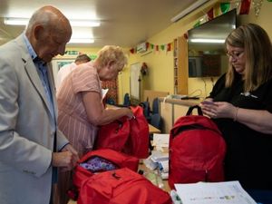 Supporting image for story: Club marks first anniversary by preparing bags of hospital essentials for children
