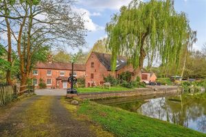 The property boasts the three-storey former mill and a large four-bedroom home. Picture: Rightmove/Halls.