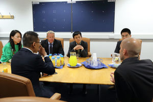 Guochuan Lai meets West Bromwich Albion Academy Manger, Mark Harrison.
