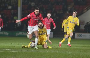 Oisin McEntee sprints forward for Walsall.