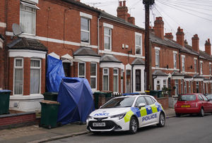 A police car at the scene on Newcombe Road in Coventry, following a double stabbing