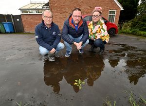 Residents from Rushwater Close, Wombourne are fed up with with flooding near to their homes. Pictured are Adrian Sherriff, Dawn Garbett and Richard Elphick