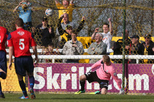 Ryan Young of AFC Telford United watches as Nathan Hicks' penalty hits the back of the net to level the scores at 2-2