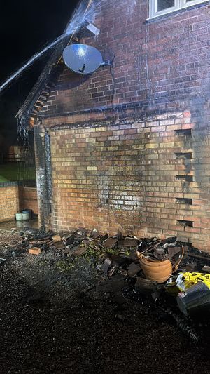 A passer-by had spotted the large wooden log store ablaze, with flames spreading to the side of a two-storey garage. Picture: Bridgnorth Fire Station