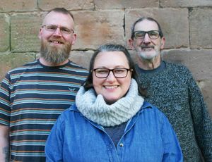 Left to right: Vicki and John, foster parents, Martin George, NCF.