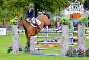 Sarah Millington jumping in the arena