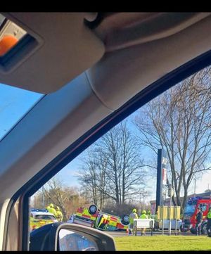 A 4x4 fire truck overturned after a collision with a car