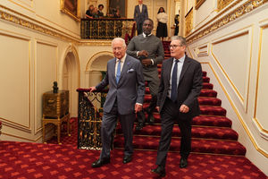 King Charles III walks with Prime Minister Sir Keir Starmer, followed by Idris Elba during the Youth Opportunity Summit at St James's Palace in London