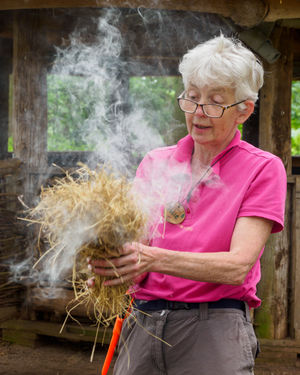 Volunteer education officer Julie Cooper demonstrates wild cooking at Fordhall Farm near Market Drayton photo: Rick Adaway