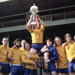 Skipper Graham Carr is chaired on a lap of honour after the Wembley victory 50 years ago.