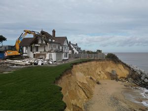 Supporting image for story: Demolition of clifftop home threatened by coastal erosion under way