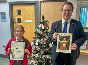 Mike Wood MO with Amelia McGrory the winner of his Christmas card competition