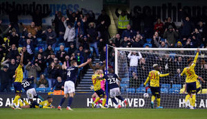 Millwall's Mason Bennett celebrates scoring their side's first goal of the game 