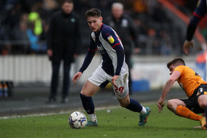 Taylor Gardner-Hickman of West Bromwich Albion best away from Keane Lewis-Potter of Hull City during the Sky Bet Championship match between Hull City and West Bromwich Albion at MKM Stadium on March 5, 2022 in Hull, England. (Photo by Adam Fradgley/West Bromwich Albion FC via Getty Images).