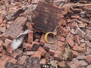 Supporting image for story: 'Original' bricks and items plucked from Crooked House rubble by 'looters' up for sale on Facebook